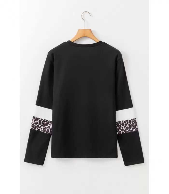 Musta pitkähihainen paita valkoisilla ja leoraidoilla