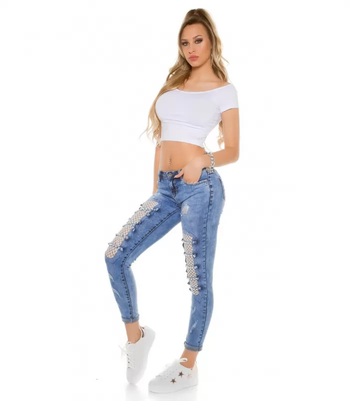 Siniset kulutetut helmikoristeiset farkut