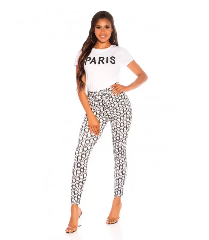 Valkomustat printtikuvioiset treggingsit vyöllä